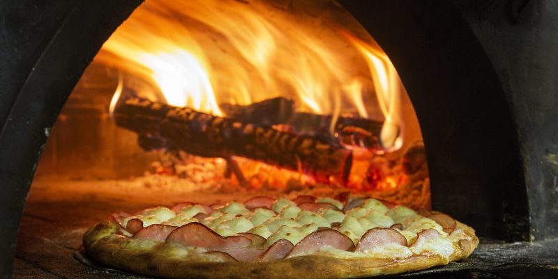 Italian pizza inside a wood oven.